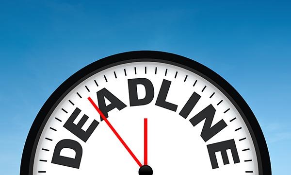 Top half of clock-face, with the word deadline emblazoned on it, the time showing six minutes to midnight. Revalidation deadlines can induce panic in NMC registrants
