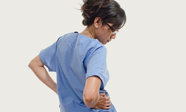 nurse rubs her back