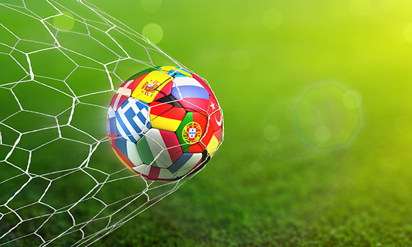 football hits the back of the net