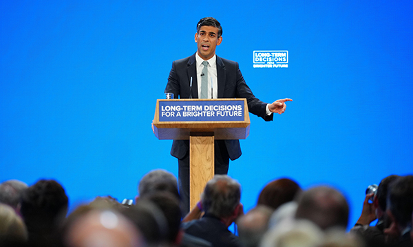 Rishi Sunak addresses audience at Conservative Party conference podium