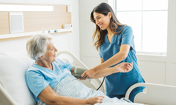 Differentiation of nursing roles: a nursing associate with a patient