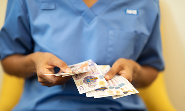 Nursing pay talks: nurse with money
