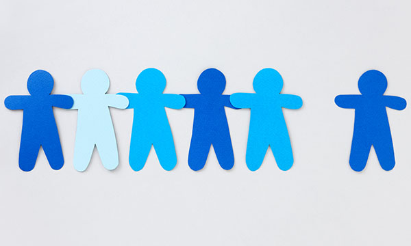 A blue paper doll chain with one figure missing