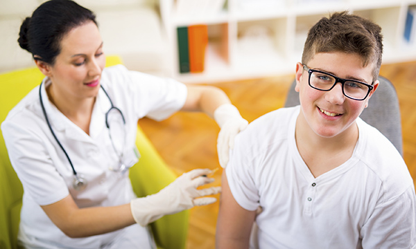 Teenager being vaccinated