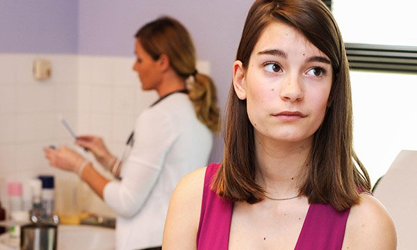 Picture shows a gynaecologist performing a cervical smear on a teenage patient. Cervical cancer is rising in women aged 25-29, reflecting their failure to attend screening, a charity says.