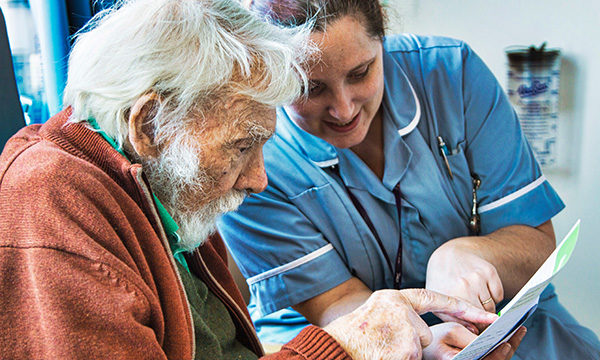 Nurse with older patient