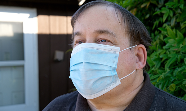 Man with a learning disability wearing a mask during the COVID-19 pandemic