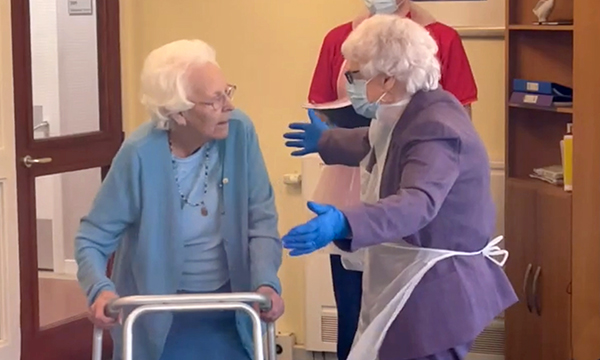 Ella (left), a resident of Greenock Medical Aid Society’s Bagatelle Care Home, is reunited with her best friend June