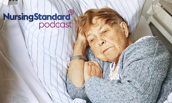 Picture of an older woman in a hospital bed, looking pensive
