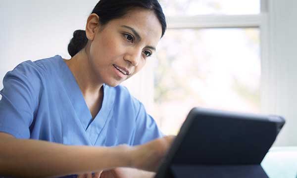Senior nurse communicating via a laptop. Picture: iStock