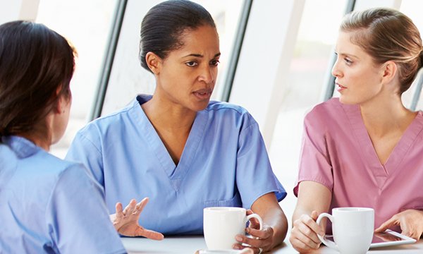 Nurses having a tea and a chat.