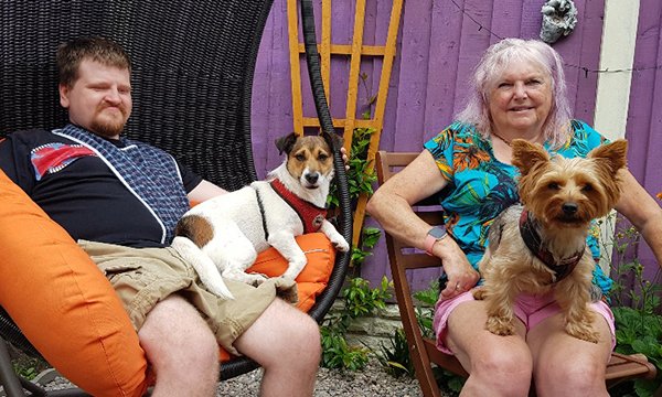 Dave Thompson, who has complex disabilities, and his mother Shelagh with pet dogs