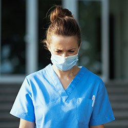 A nurse wearing a face mask at work