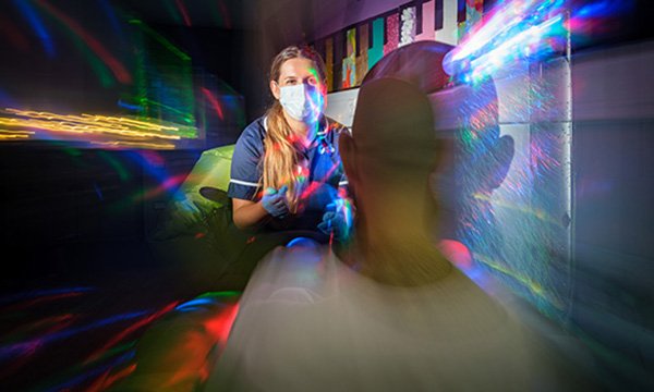 Chloe Salter working with an inmate in the sensory room. Picture: Stephen Shepherd