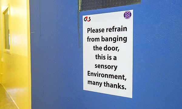 Sign on a door inside Parc prison encouraging people not to slam the door as it is a sensory environment. Picture: Stephen Shepherd