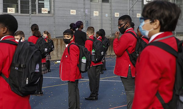 Picture shows schoolchildren in uniform with masks due to COVID-19 regulations