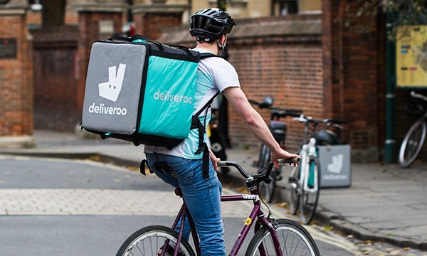 Deliveroo cyclist with a food delivery. The food delivery company is relaunching its Support the NHS campaign with food deliveries to hospitals