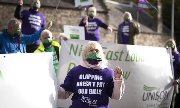 NHS workers and Unison members from Lothian Health Branch and Scottish Healthcare take part in a rally outside the Scottish Parliament, Edinburgh, calling for the three-year NHS pay deal to be renegotiated