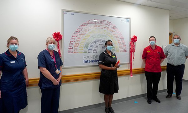 Intensive care unit nurse Laura Kirby-Deacon (second from left) at the unveiling of the mural she created at Great Western Hospitals NHS Foundation Trust in Swindon