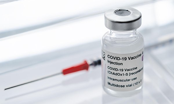 Vial of AstraZeneca COVID-19 vaccine and syringe 