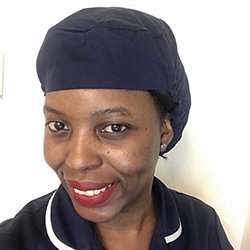 Ward manager Noni Nyathi wearing the head covering she proposed as a uniform option for trust staff