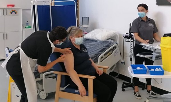 Orthopaedic nurse Ewa Syczuk receives the booster vaccination for COVID-19