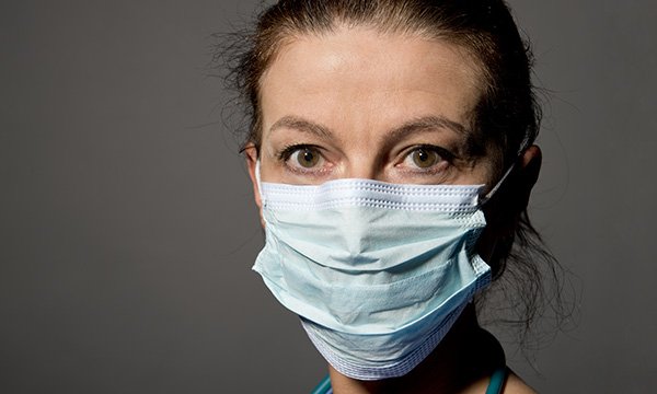 Nurse wearing a mask: an open letter of support from UK’s four chief nursing officers and NMC chief acknowledges ongoing staff pressures as winter approaches