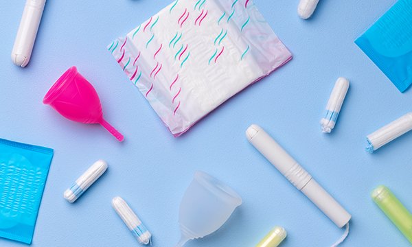 selection of sanitary items, including tampons, pads and a menstrual cup