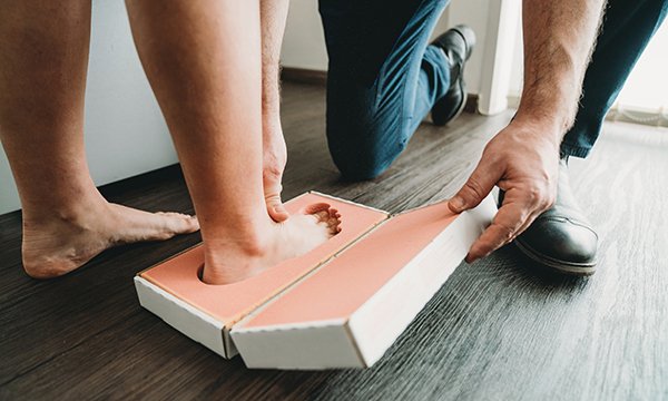 Following his discharge from the emergency department, the service user was referred to a podiatrist team to fit suitable footwear for his needs
