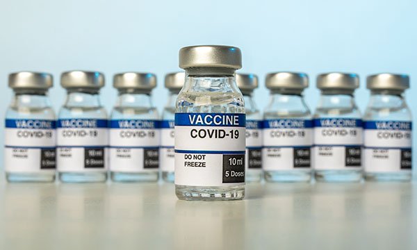 Coronavirus vaccine phials as TUC calls on halt of NHS vaccine mandate plan
