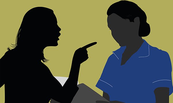 Silhouette image of woman confronting a nurse and pointing a finger at her