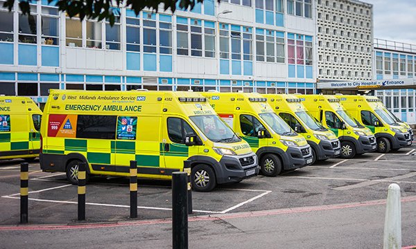 Photo of ambulances lined up outside a hospital
