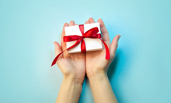 Hands holding a wrapped gift