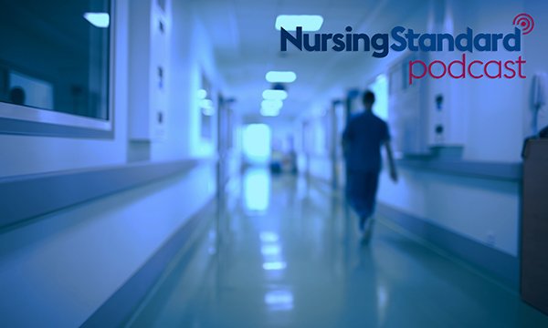 Picture of someone walking down a hospital corridor at night