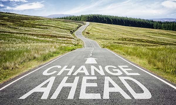 Illustration showing the sign ‘change ahead’ on a road, highlighting that a secondment could offer the change in direction your career needs