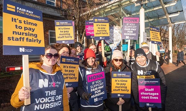 Nurses holding placards on a picket line at the Christie Hospital in Manchester