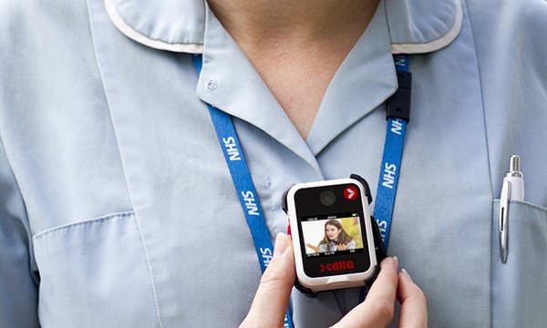 Unidentified nurse wears small body camera on the front of her uniform to deter assault from patients or the public