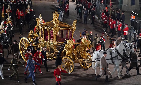 The Gold State Coach with horses and cavalry in coronation rehearsal
