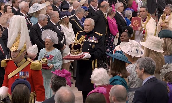 Dame Elizabeth Anionwu processes in front of the King Edward crown during the coronation service of Charles III