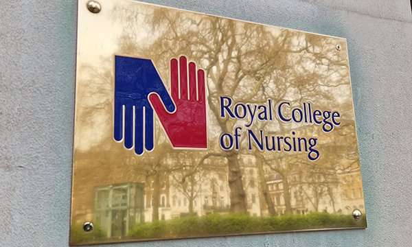 Brass plaque showing name and logo of RCN at its London headquarters