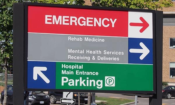 Photo of a hospital parking sign, illustrating a story about nurses' parking restrictions