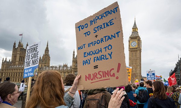 Protesters demanding better pay for nurses near parliament in May