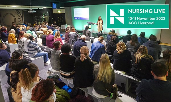 Nursing students and newly registered nurses attending a session such as those that will be on offer at Nursing Live, listening to a speaker on a stage