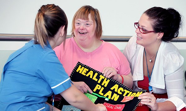 Photo of community nurse caring for patient, illustrating story about new standards of practice