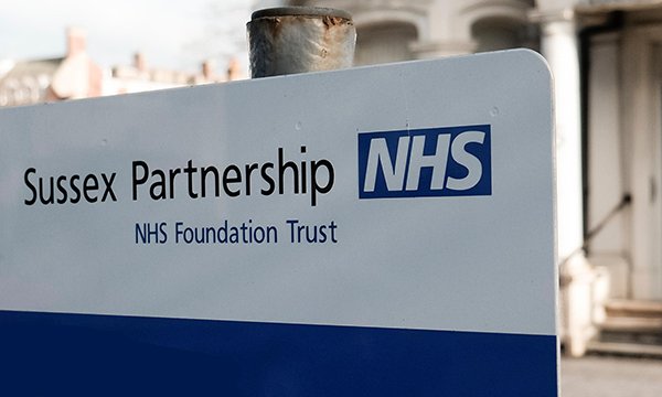 Photo of Sussex Partnership NHS Foundation Trust sign, illustrating a story about the trust offering jobs to nursing graduates
