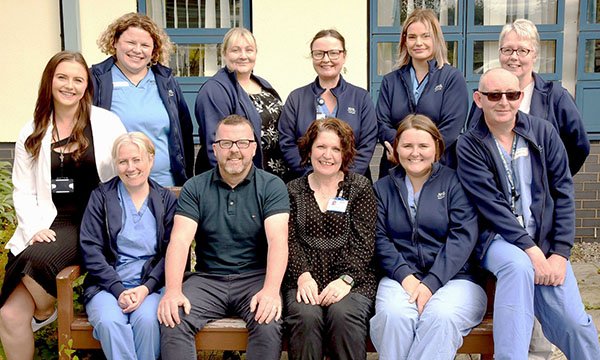 Chief Nursing Officer’s award winners the Highland Urology Nursing Team; members are pictured outside, some sitting on a bench and the others standing behind