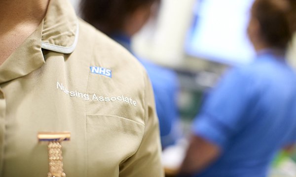 A close up of the uniform of a nursing associate