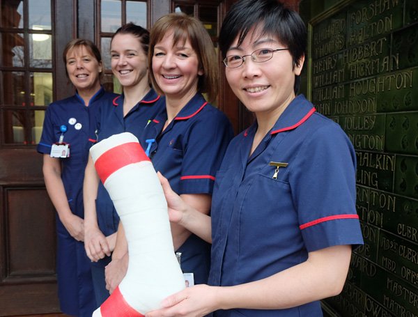 Warrington and Halton Hospitals nurses Rachael Browning, Grace Delaney-Segar, Heather Aston and Xiurong Deng with a red banded plaster cast