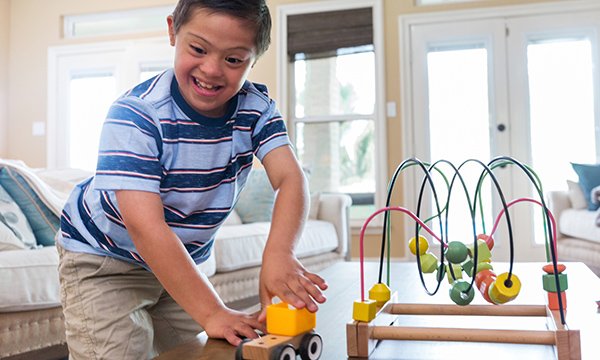 Picture shows a boy playing with toys. Children with learning disabilities from black, Asian and minority ethnic (BAME) groups are dying at disproportionately younger ages, according to a national review