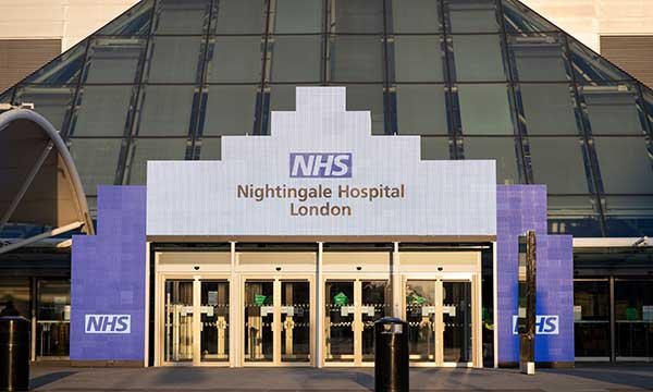 Picture shows entrance to London Nightingale hospital. Article is a nurse’s account of a shift at the critical care temporary hospital, which is now on standby